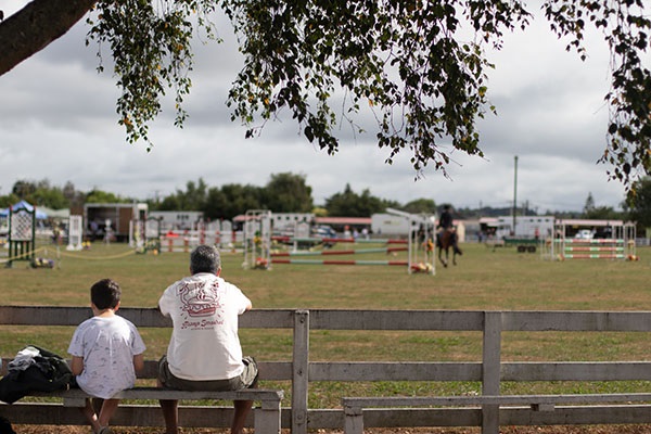 Royal API show - Father and Son sitting on the fence.